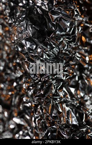 Aluminium Blattwerk Lichteffekte Design Feuershow Party festliche Dekorationen abstrakt verschwommener Hintergrund leuchtende Textur glänzendes Muster große, moderne Größe Stockfoto
