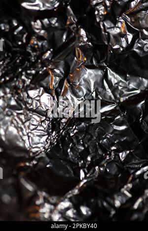 Aluminium Blattwerk Lichteffekte Design Feuershow Party festliche Dekorationen abstrakt verschwommener Hintergrund leuchtende Textur glänzendes Muster große, moderne Größe Stockfoto