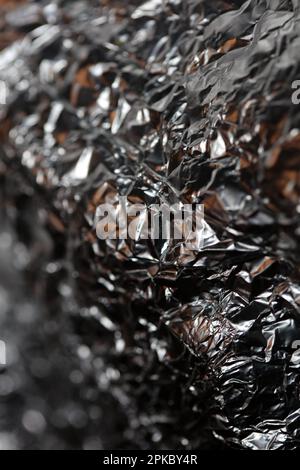 Aluminium Blattwerk Lichteffekte Design Feuershow Party festliche Dekorationen abstrakt verschwommener Hintergrund leuchtende Textur glänzendes Muster große, moderne Größe Stockfoto