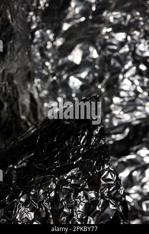 Aluminium Blattwerk Lichteffekte Design Feuershow Party festliche Dekorationen abstrakt verschwommener Hintergrund leuchtende Textur glänzendes Muster große, moderne Größe Stockfoto