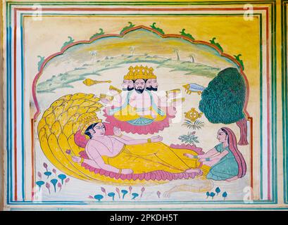 Farbenfrohe mythologische Gemälde an der Außenwand des Palastes Sisodia Rani und des Gartens. Erbaut von Maharaja Sawai Jai Singh II. Im Jahr 1710 n. Chr. für seine Königin. Stockfoto