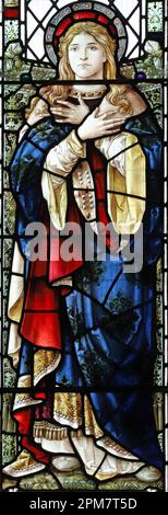 Buntglasfenster von Percy Bacon mit der Tugend Charity, St. Mary's Church, Cumwhitton, Cumbria Stockfoto