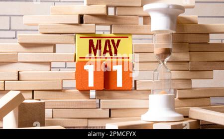 Tag im Kalender, 11. Mai auf Holzblock. Stockfoto