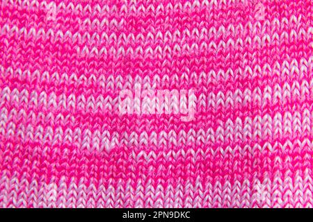 Hellrosa Strickpullover als Hintergrund Stockfoto