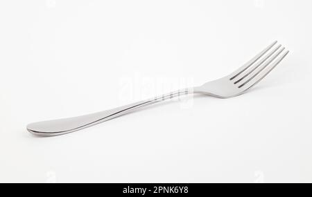 Metallgabel auf weißem Hintergrund. Vorderansicht. Stockfoto