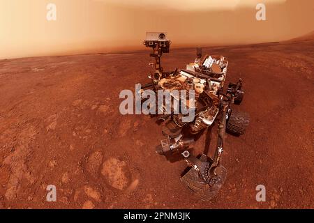 Ein Rover auf der Oberfläche des roten Planeten Mars. Elemente dieses Bildes lieferten die NASA. Stockfoto