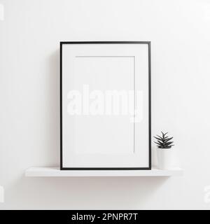 Schwarzer Bilderrahmen mit rechteckiger vertikaler Form, der auf einem weißen Regal an einem Wandmodell für Bilder und Poster steht Stockfoto