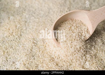 Weißer Reis Holzlöffel Hintergrund Stockfoto