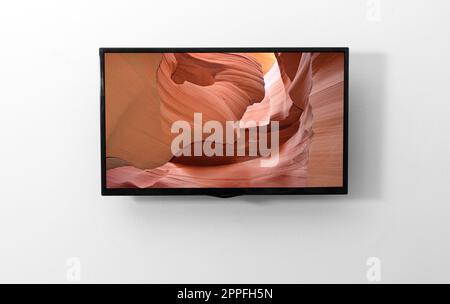 TV-Monitor an der Wand Stockfoto