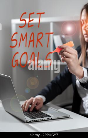 Hand schreiben Zeichen setzen Smart Ziele. Wort für erreichbare Ziele festlegen Machen Sie gute Geschäftspläne Stockfoto
