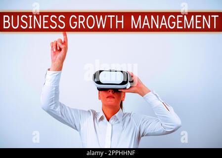 Schreiben mit dem Text Business Growth Management. Wort für die Verbesserung eines Maßes für den Unternehmenserfolg Stockfoto