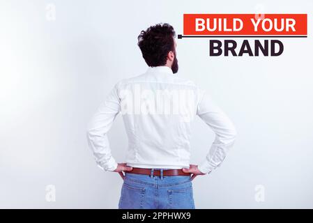 Unterschreiben Sie, und zeigen Sie „Build Your Brand“ an. Wort geschrieben auf Make a Commercial Identity Marketing Advertisement Stockfoto