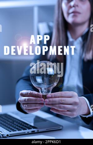 Textunterschrift zur App-Entwicklung. Wort für die Herstellung von Computersoftware mit einem speziellen Zweck Stockfoto