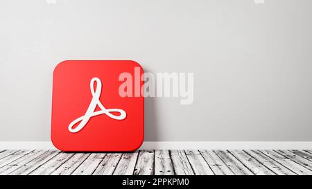 Adobe Acrobat App-Symbol auf Holzboden an der Wand Stockfoto