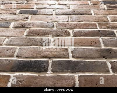 Alte Backsteinwand-Hintergrundtextur. Nahaufnahme. Mauermuster aus Ziegelstein Stockfoto