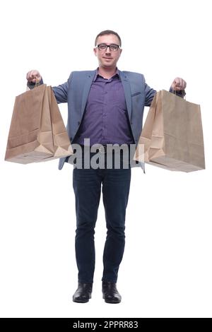 Gut aussehender junger Mann, der Einkaufstaschen hält Stockfoto