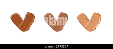 Verschiedene Hauttöne Make-up-Fundamente schmieren in Form von Herzen auf Weiß. Stockfoto