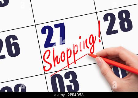 27. Tag des Monats. Handgeschriebener Text ZUM EINKAUFEN und Zeichnen einer Linie am Kalenderdatum. Business Online-Angebote Black Friday Werbekonzept Tag der Stockfoto