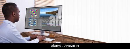 Ein Geschäftsmann, Der Das Video Am Computer Bearbeitet Stockfoto