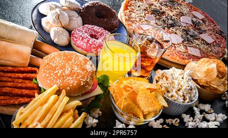 Lebensmittel, die das Krebsrisiko erhöhen. Junk Food Stockfoto