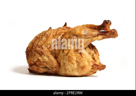Ganze Rotisserie Huhn isoliert auf weißem Hintergrund Stockfoto