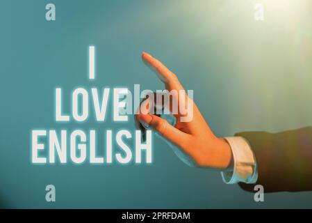 Inspiration mit dem Schild „I Love English“. Geschäftsidee, Zuneigung zu internationaler Sprache zu haben, Grammar Geschäftsmann im Anzug, der einen Notizblock hält, der erfolgreiche Teamarbeit symbolisiert. Stockfoto
