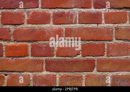 Die Dinge im Gebäude zu halten und die Dinge draußen zu halten. Eine Backsteinmauer. Stockfoto