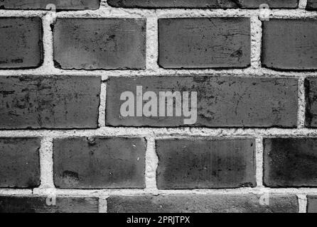 Die Dinge im Gebäude zu halten und die Dinge draußen zu halten. Eine Backsteinmauer. Stockfoto