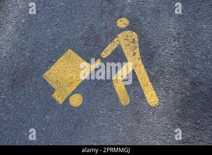 Schild für Be- und Entladebereich auf Asphalt lackiert Stockfoto