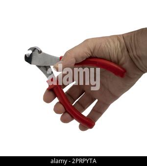 Ein Paar Zangen in der Hand eines Mannes auf einem transparenten Hintergrund Stockfoto