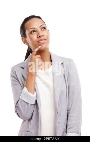 Sie nimmt mehr als einen Pfennig für ihre Gedanken. Eine junge Frau, die tief in Gedanken in einem Studio steht. Stockfoto