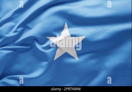 Schwenkende Nationalflagge Somalias Stockfoto