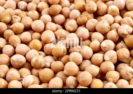 Gelb getrocknete Kichererbsen oder Kichererbsen-Struktur im Nahbereich. Stockfoto