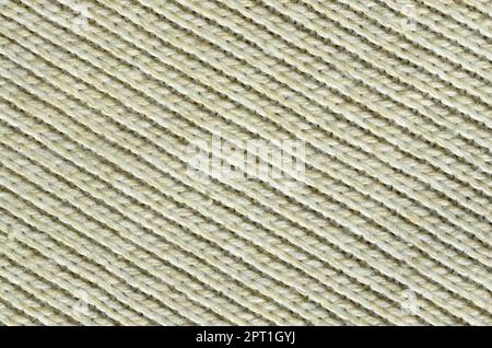 Stoffstruktur eines weichen gelben Strickpulvers. Makrobild der Bindungsstruktur in Garnen Stockfoto