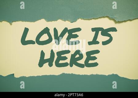 Inspiration zeigt das Zeichen Liebe ist hier, ein Wort geschrieben auf Romantik Feeling Lovely Emotion positive Expression Care Joy Stockfoto