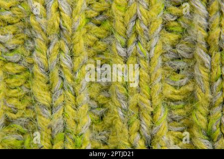 Hellgrüner Hintergrund von Strickpullover im Nahbereich Stockfoto