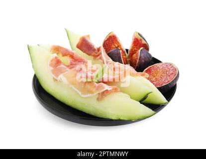 Teller mit leckerer Melone, Jamon und Feigen isoliert auf Weiß Stockfoto