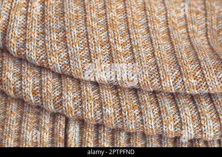 Meliert beige gestrickten Wollpullover. Textur Detail Nahaufnahme. Stockfoto