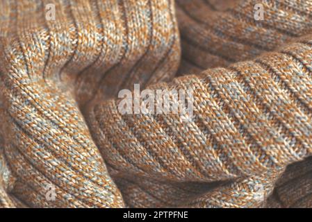 Meliert beige gestrickten Wollpullover. Textur Detail Nahaufnahme. Stockfoto