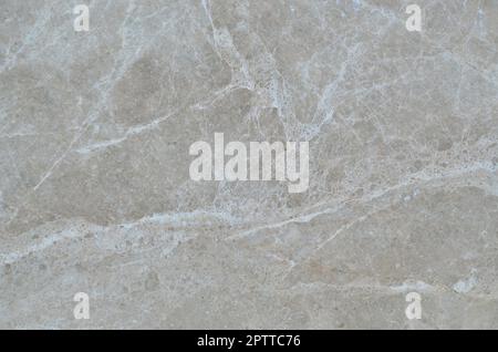 Textur einer festen und glatten beige Marmor Oberfläche als Material für die Dekoration von Wänden im Innenraum und die Fassade in der Form von rechteckigen Fliesen Stockfoto