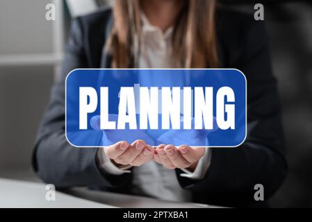Hand schreiben Zeichen Planung, Wort für den Prozess des Nachdenkens über die Aktivitäten erforderlich, um ein Ziel zu erreichen Stockfoto