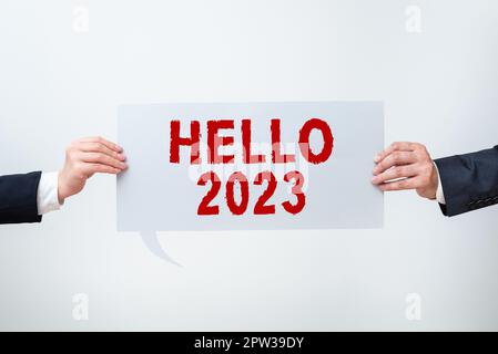 Schild mit „Hello 2023, Conceptual Photo Hoping for a Greatness To the coming New year“ Stockfoto