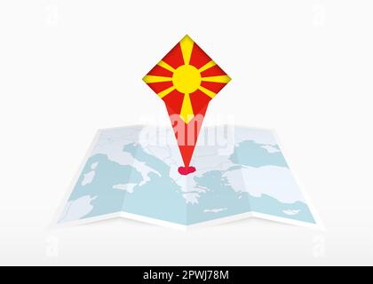 Nordmazedonien ist auf einer gefalteten Papierkarte und einer fixierten Positionsmarkierung mit der Flagge Nordmazedoniens abgebildet. Gefaltete Vektorkarte. Stock Vektor