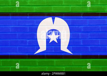 Die Flagge des australischen Torres Strait Islanders malte auf einer Ziegelwand Stockfoto