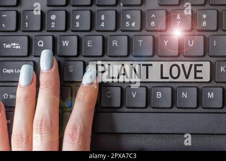 Konzeptionelle Überschrift Plant Love, ein Wort auf einem Symbol für emotionale Liebe, Fürsorge und Unterstützung, das anderen gezeigt wird Stockfoto