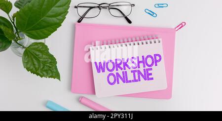 Schild mit der Aufschrift Workshop Online, Word auf dem Raum oder Gebäude, in dem die Waren repariert werden Stockfoto