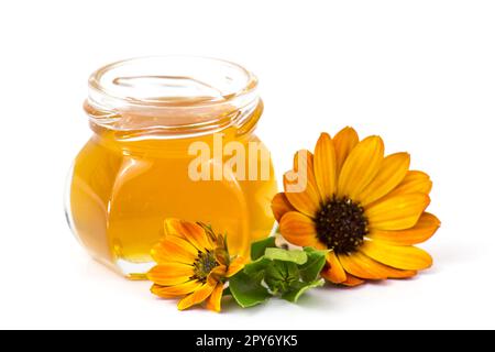 Honig und Blumen auf weißem Hintergrund Stockfoto