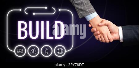 Schreiben mit Anzeige von Text Build. Ein Wort für etwas konstruieren, indem man Material über einen bestimmten Zeitraum zusammenstellt Stockfoto