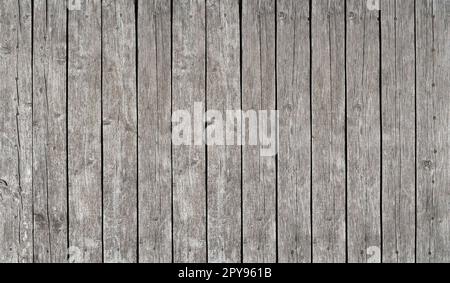 Alter alter grauer Holzzaun mit Planken Stockfoto