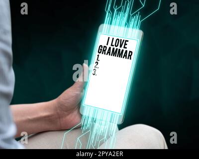 Schreiben mit Text „I Love Grammar“. Begrifflicher Fotoakt des Bewunderungssystems und der Sprachstruktur Stockfoto
